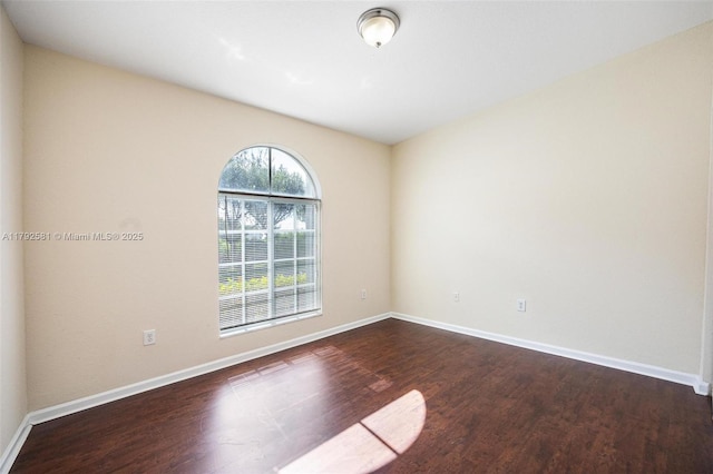 27056 SW 140th Pl, Homestead, FL 33032 - spare room with wood finished floors and baseboards