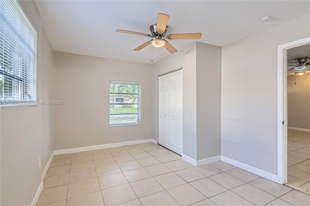 7740 Shalimar St, Miramar, FL 33023 - unfurnished bedroom featuring baseboards, a ceiling fan, a closet, and light tile patterned flooring