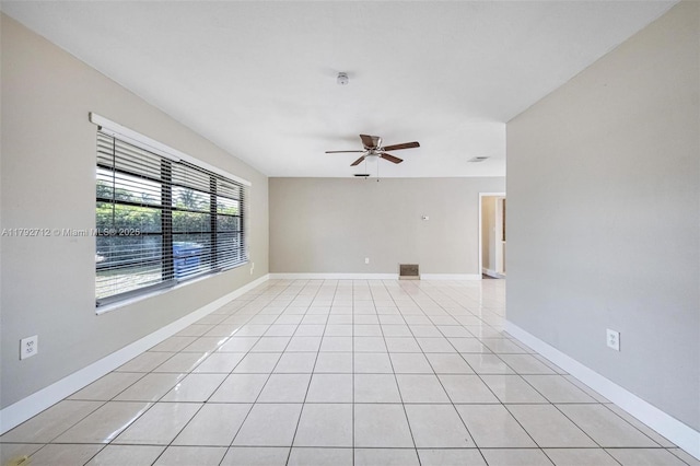 7817 NE Madeira St, Miramar, FL 33023 - spare room with baseboards, a ceiling fan, and light tile patterned floors
