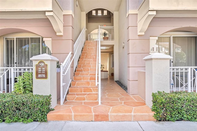 view of exterior entry featuring stucco siding