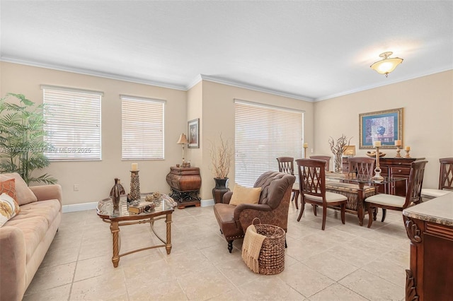 living area with baseboards, ornamental molding, and light tile patterned flooring