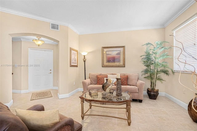 living room featuring crown molding, light tile patterned flooring, arched walkways, baseboards, and visible vents