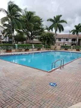 community pool featuring a patio area
