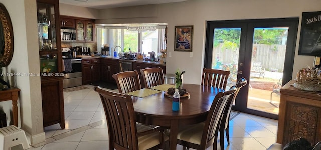 8111 SW 205th St, Cutler Bay, FL 33189 - dining area featuring french doors and light tile patterned floors