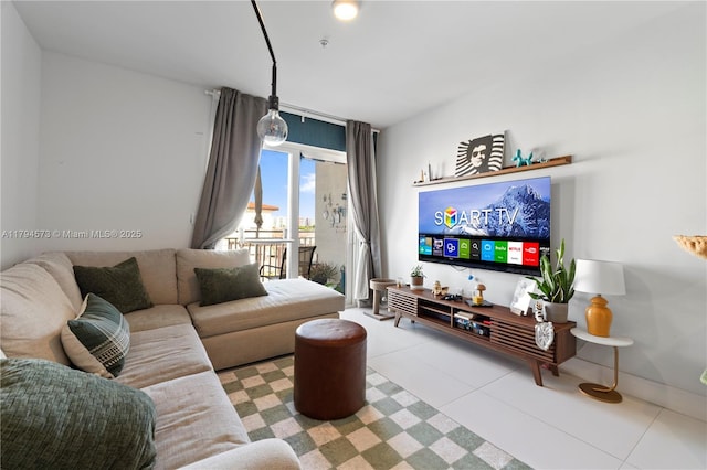 living area featuring tile patterned floors