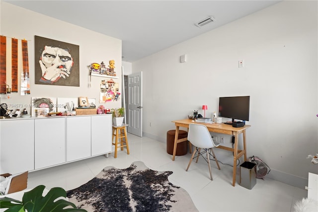 home office featuring baseboards and visible vents