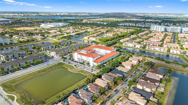 birds eye view of property featuring a residential view and a water view