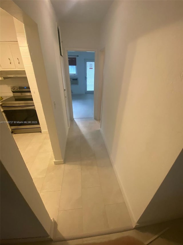 600 Layne Unit 216, Hallandale Beach, FL 33009 - corridor with baseboards and light tile patterned floors