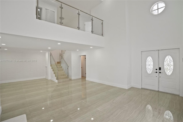 12894 SW 60th Ter, Miami, FL 33183 - foyer featuring stairs, a high ceiling, and baseboards
