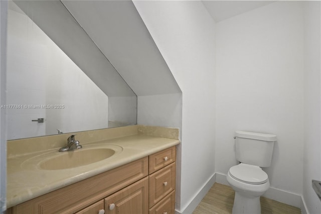 12894 SW 60th Ter, Miami, FL 33183 - bathroom with baseboards, wood finished floors, toilet, and vanity
