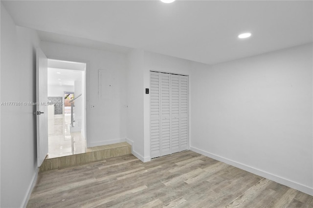 12894 SW 60th Ter, Miami, FL 33183 - unfurnished bedroom featuring baseboards, a closet, recessed lighting, and wood finished floors