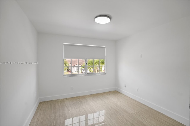 12894 SW 60th Ter, Miami, FL 33183 - empty room featuring baseboards and wood finished floors