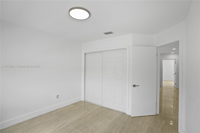 12894 SW 60th Ter, Miami, FL 33183 - unfurnished bedroom featuring light wood finished floors, recessed lighting, baseboards, visible vents, and a closet