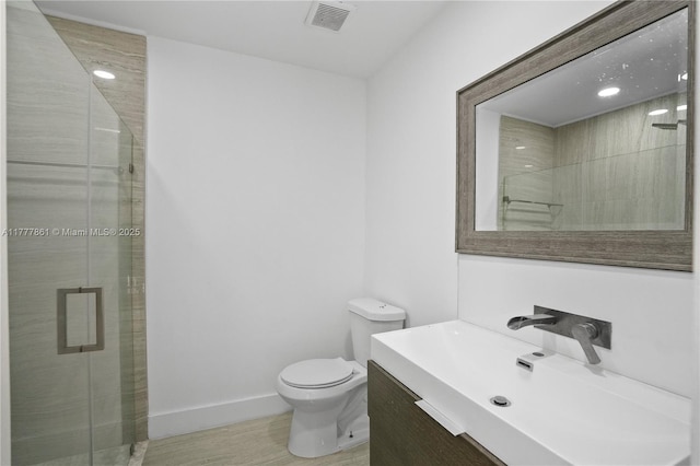 12894 SW 60th Ter, Miami, FL 33183 - bathroom with visible vents, vanity, toilet, baseboards, and a shower stall