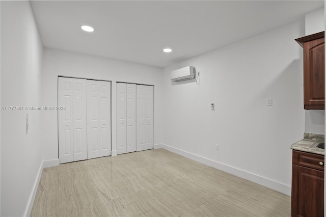 12894 SW 60th Ter, Miami, FL 33183 - interior space with baseboards, two closets, recessed lighting, and a wall mounted air conditioner