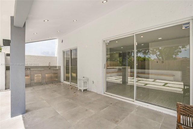 12894 SW 60th Ter, Miami, FL 33183 - view of patio featuring a sink and exterior kitchen