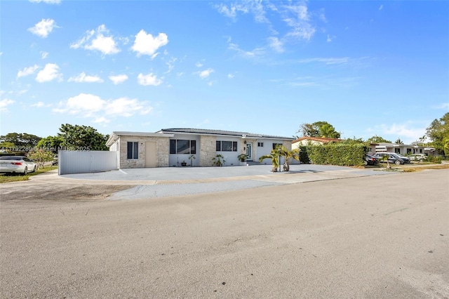 9365 SW 44th St, Miami, FL 33165 - ranch-style house with fence and stone siding