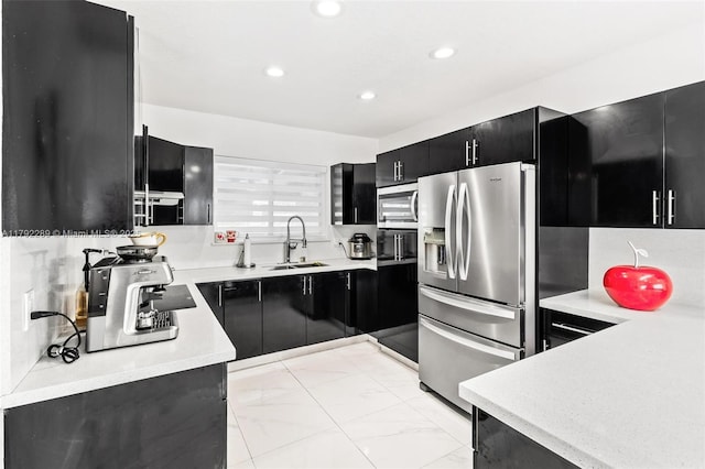 9365 SW 44th St, Miami, FL 33165 - kitchen featuring a sink, dark cabinetry, light countertops, stainless steel appliances, and recessed lighting