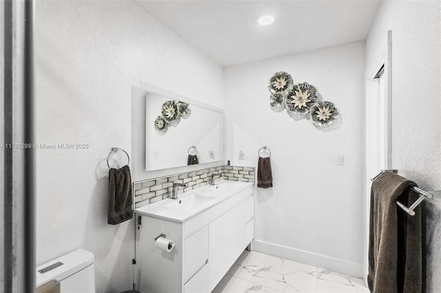 9365 SW 44th St, Miami, FL 33165 - bathroom with vanity, decorative backsplash, marble finish floor, toilet, and baseboards