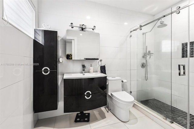 9365 SW 44th St, Miami, FL 33165 - bathroom with tile patterned flooring, vanity, toilet, tile walls, and a shower stall