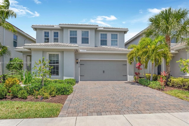 4317 Ficus St, Hollywood, FL 33021 - traditional home featuring stucco siding, an attached garage, decorative driveway, and a tile roof