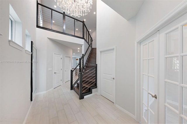 4317 Ficus St, Hollywood, FL 33021 - entryway featuring a towering ceiling, stairway, baseboards, a notable chandelier, and recessed lighting