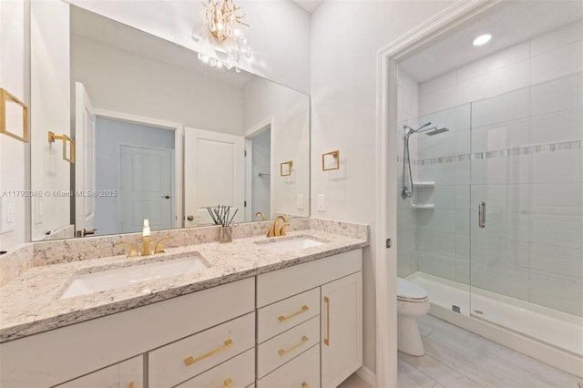 4317 Ficus St, Hollywood, FL 33021 - bathroom featuring double vanity, a sink, a stall shower, and toilet