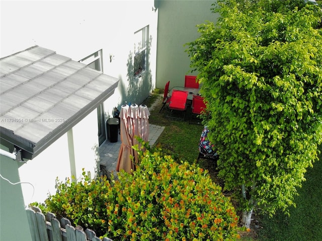 3064 SE 1st Dr Unit 3, Homestead, FL 33033 - view of side of home with stucco siding and metal roof