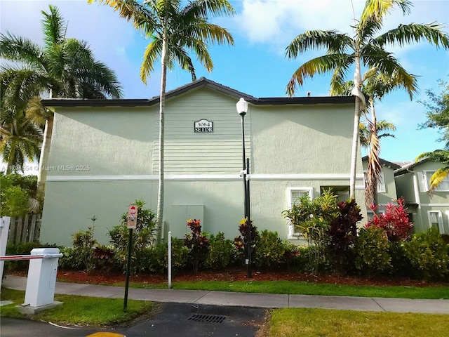 3064 SE 1st Dr Unit 3, Homestead, FL 33033 - view of side of property featuring stucco siding