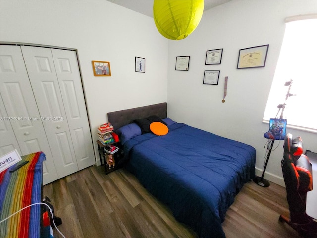 bedroom with a closet and wood finished floors