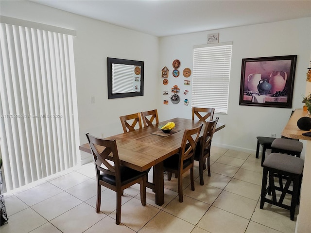 3064 SE 1st Dr Unit 3, Homestead, FL 33033 - dining space featuring baseboards and light tile patterned floors