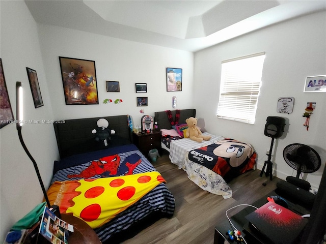 bedroom featuring wood finished floors