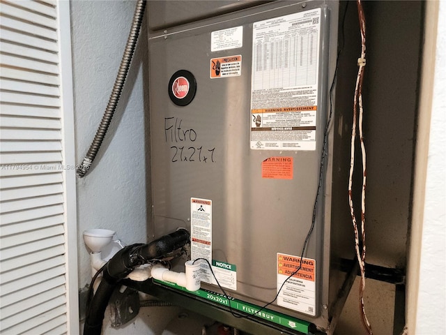 utility room with heating unit