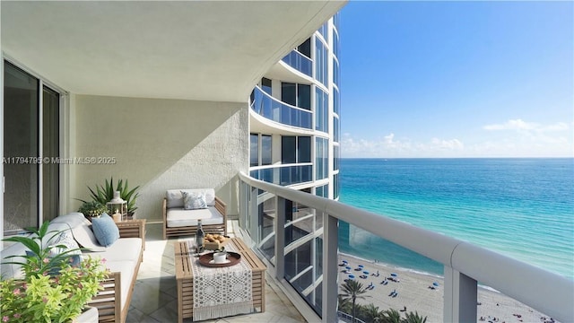 balcony with a beach view and a water view