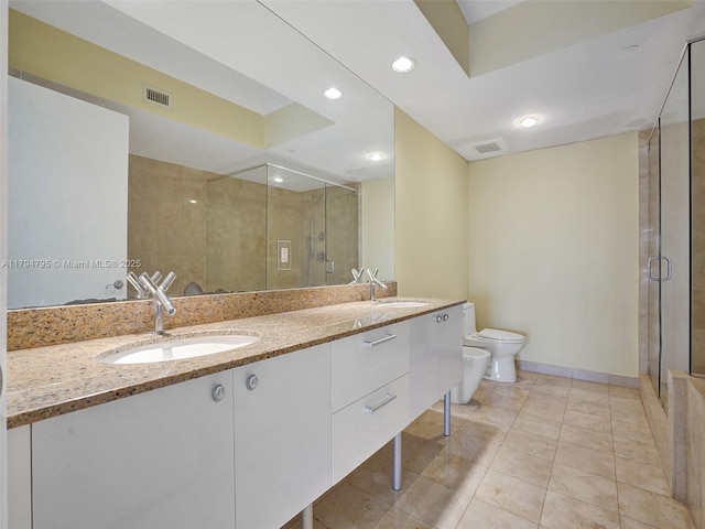 17201 Collins Ave Unit 1704, Sunny Isles Beach, FL 33160 - bathroom featuring visible vents, a sink, and a shower stall