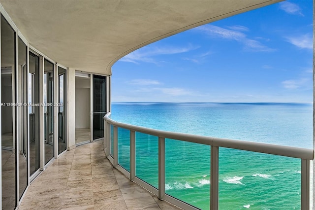 balcony featuring a water view