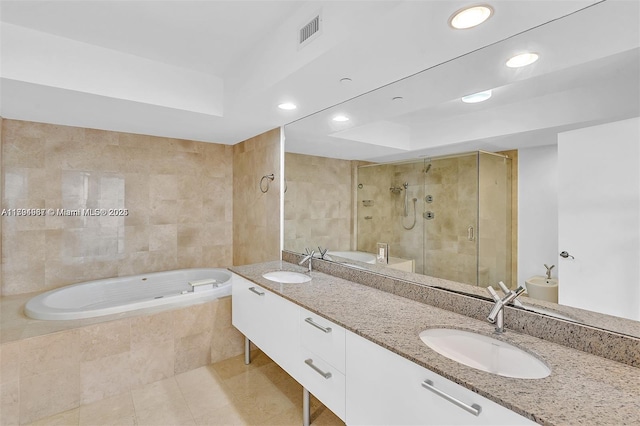 full bathroom featuring a sink, tile patterned floors, a shower stall, and visible vents