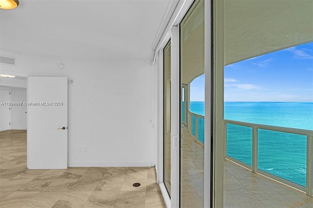 interior space featuring visible vents and a water view