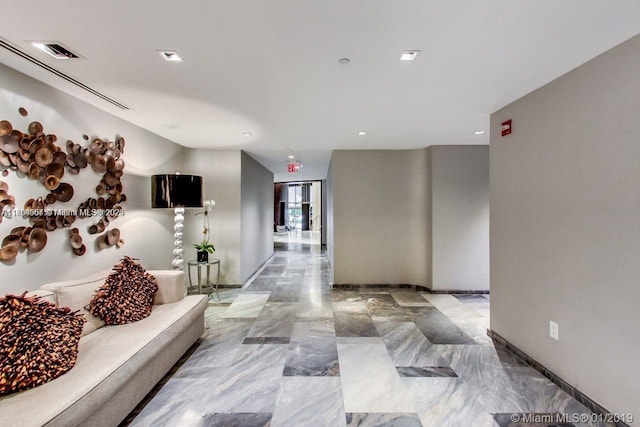 corridor with recessed lighting, marble finish floor, and visible vents