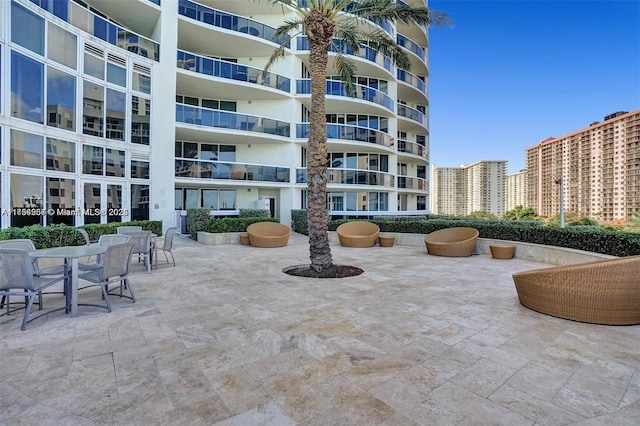 view of home's community with a patio area