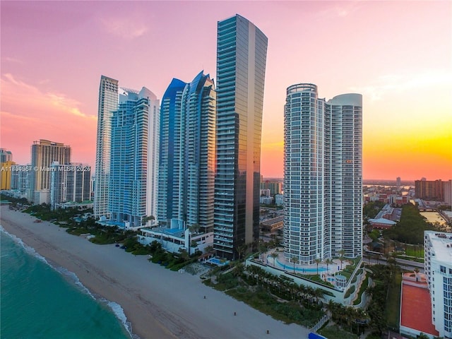 city view featuring a view of the beach and a water view