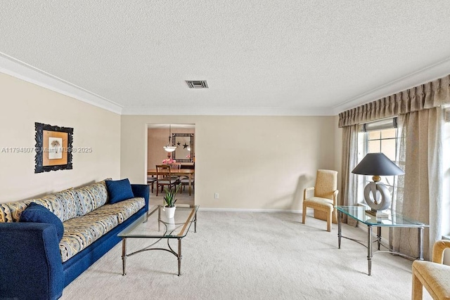living room with a textured ceiling, crown molding, visible vents, and carpet floors