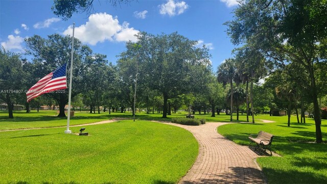 7640 NW 6th Ct, Plantation, FL 33324 - surrounding community with a yard
