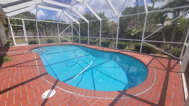 7640 NW 6th Ct, Plantation, FL 33324 - view of pool with a fenced backyard, glass enclosure, and a patio
