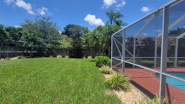 7640 NW 6th Ct, Plantation, FL 33324 - fenced backyard with glass enclosure and a patio