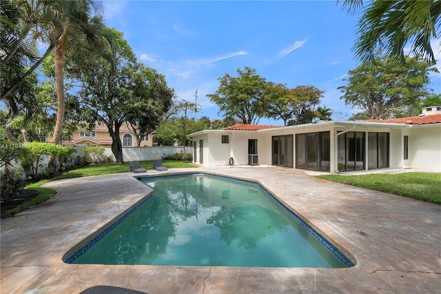 549 NE 12th Ave, Fort Lauderdale, FL 33301 - view of pool with a sunroom, fence, a fenced in pool, and a patio area