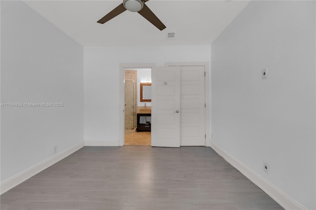 549 NE 12th Ave, Fort Lauderdale, FL 33301 - empty room featuring visible vents, a ceiling fan, baseboards, and wood finished floors