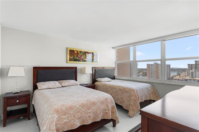 bedroom with a view of city