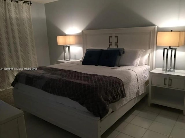 bedroom with light tile patterned flooring