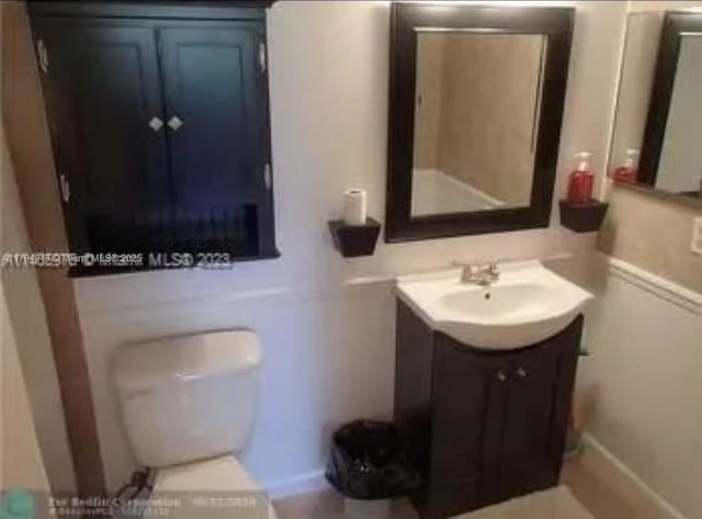 bathroom with vanity and toilet